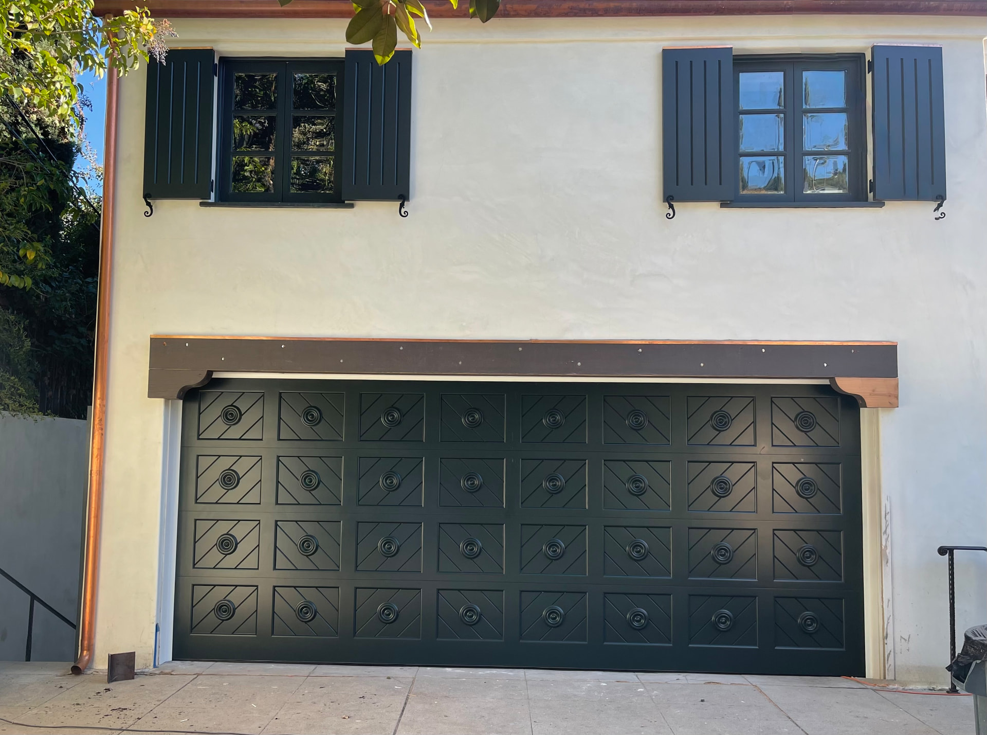 Custom black chevron garage door installed at a home